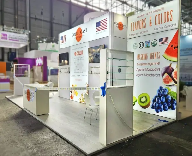 Custom Trade Show Booth by Expo Creators for Gold Coast Flavors & Colors, featuring turnkey fabrication, vibrant graphics, and storage solutions.