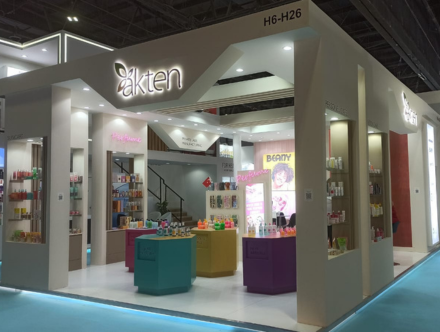 akten booth by Expo Creators with vibrant displays, detailed fabrication, colorful product showcasing, and turnkey design.